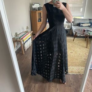 Black sleeveless gown see through checkered skirt
